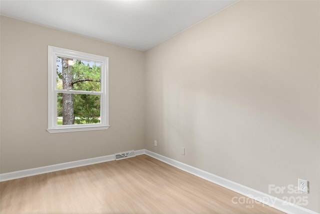 unfurnished room featuring light hardwood / wood-style flooring