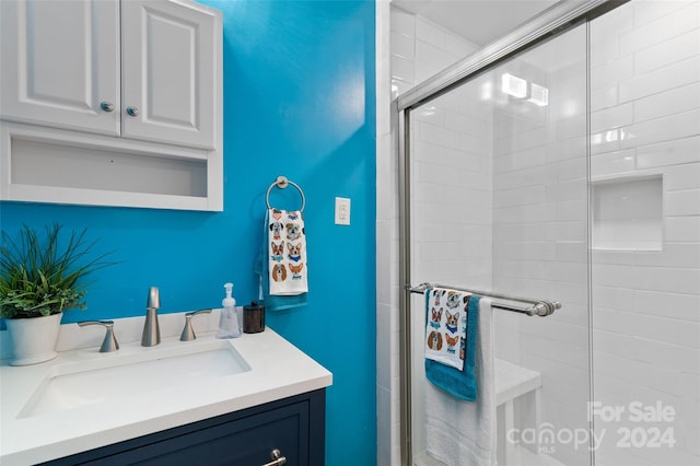 bathroom with vanity and walk in shower