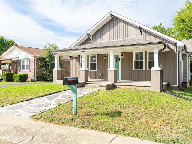 view of front of home featuring a porch and a front yard