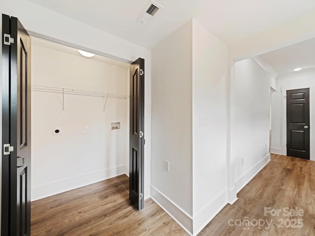 hallway featuring wood-type flooring