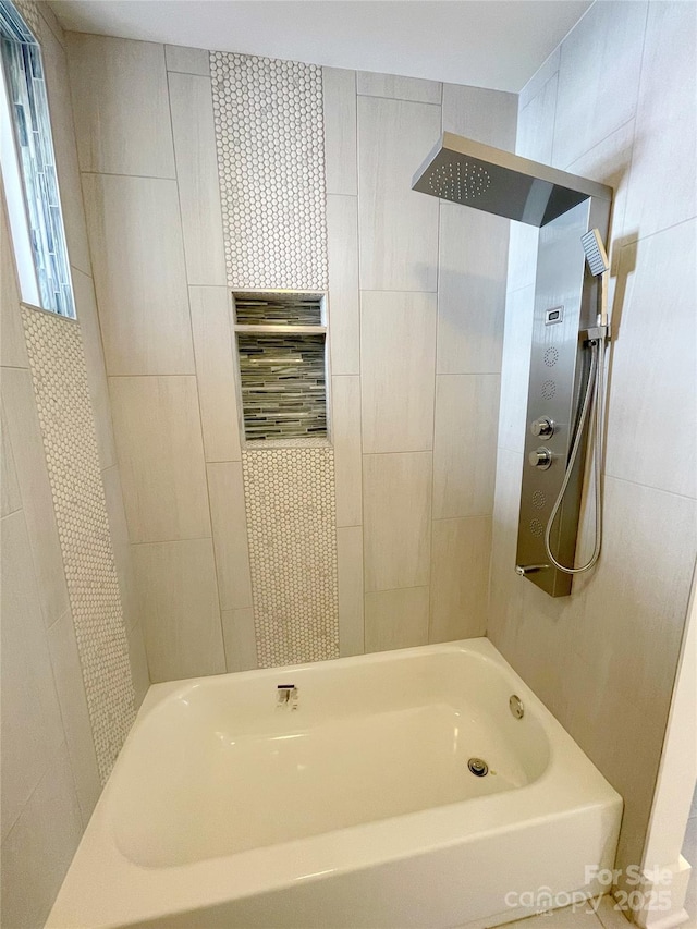 bathroom with shower / bath combination