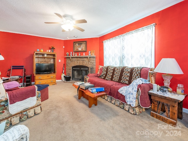 living room featuring ceiling fan, a textured ceiling, a fireplace, and carpet flooring