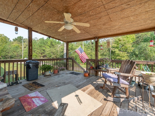 wooden deck featuring ceiling fan