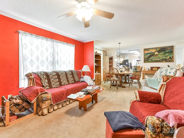 carpeted living room featuring ceiling fan, a textured ceiling, and a wealth of natural light