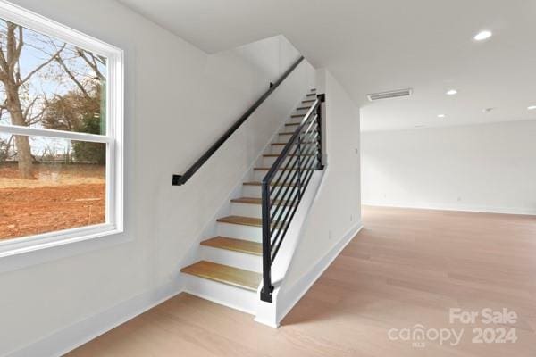 stairs with wood-type flooring