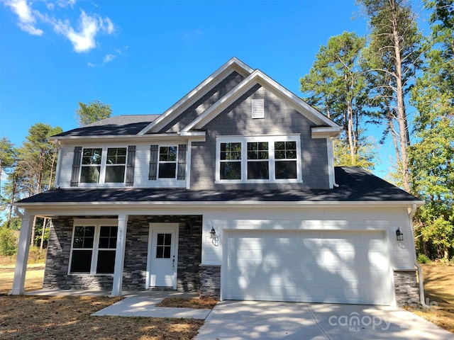 craftsman-style home with a garage