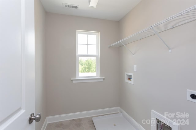 washroom featuring washer hookup and electric dryer hookup