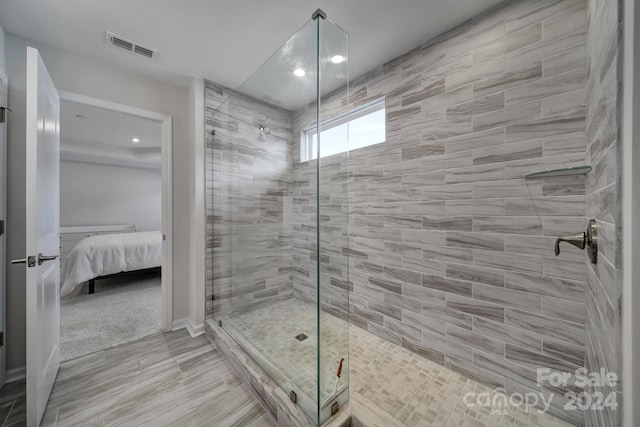 bathroom featuring a tile shower