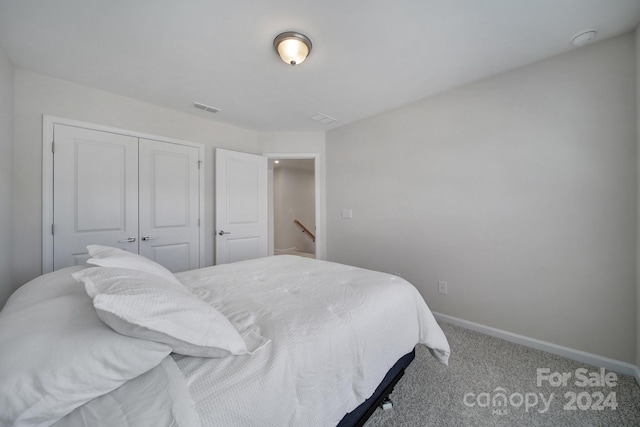 carpeted bedroom with a closet