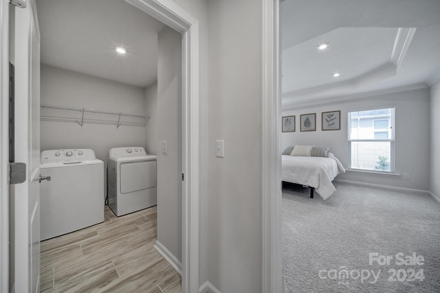 washroom featuring independent washer and dryer and light colored carpet