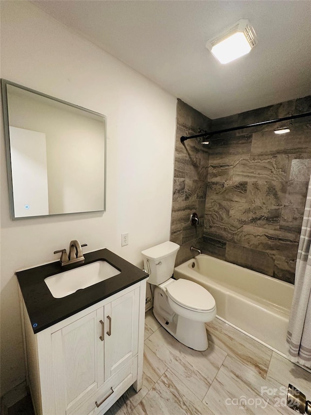 full bathroom with vanity, toilet, and shower / tub combo