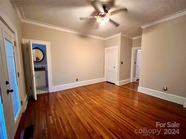 unfurnished bedroom with dark wood-type flooring, ceiling fan, and crown molding