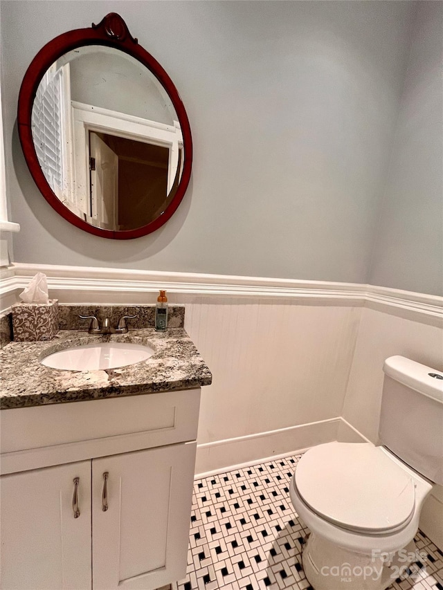 bathroom with toilet and vanity