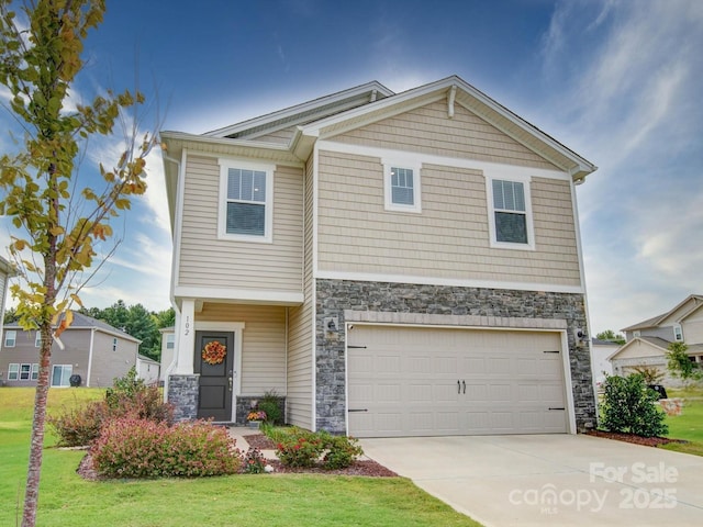 view of front facade featuring a front yard and a garage