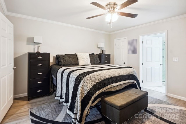 bedroom featuring ornamental molding, ceiling fan, and light hardwood / wood-style floors