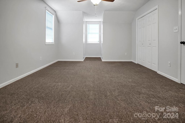 interior space featuring ceiling fan and vaulted ceiling