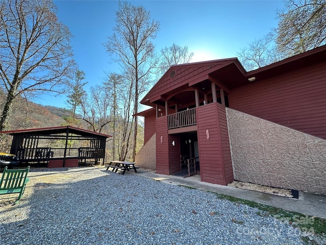 view of side of property featuring a balcony