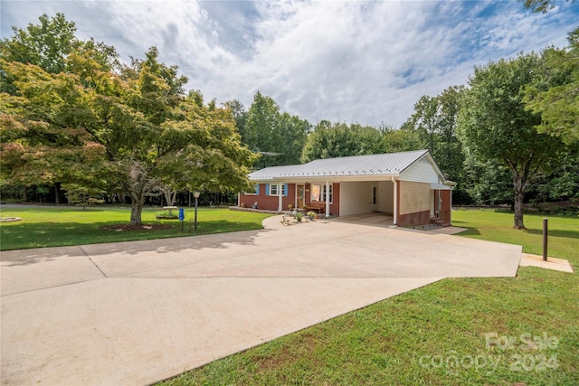 single story home featuring a carport and a front yard