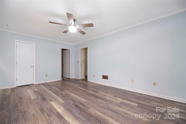 unfurnished room featuring ceiling fan, hardwood / wood-style flooring, and ornamental molding