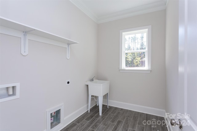 washroom featuring dark wood-type flooring, electric dryer hookup, washer hookup, and crown molding