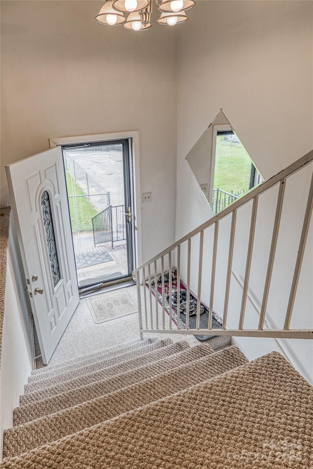 entryway with carpet flooring