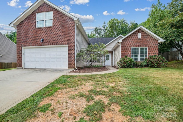 front of property featuring a garage and a front lawn