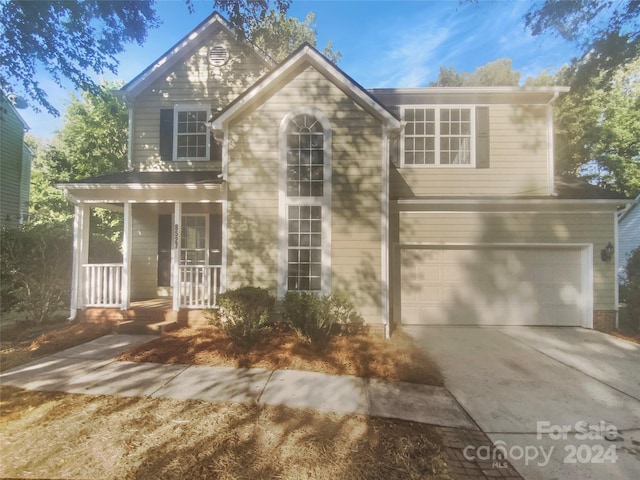 front of property featuring a garage and a porch