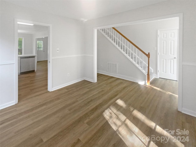 empty room featuring dark wood-type flooring