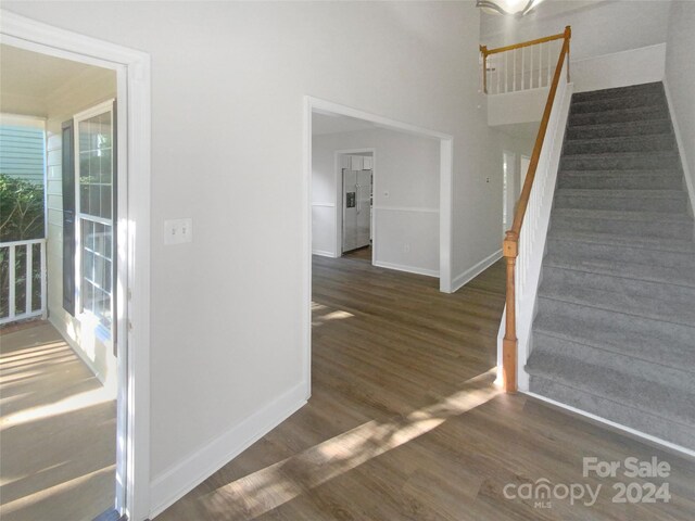 interior space featuring wood-type flooring and a healthy amount of sunlight