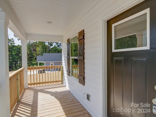 wooden deck featuring a porch