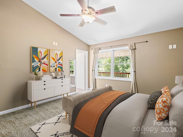 carpeted bedroom featuring ceiling fan and vaulted ceiling