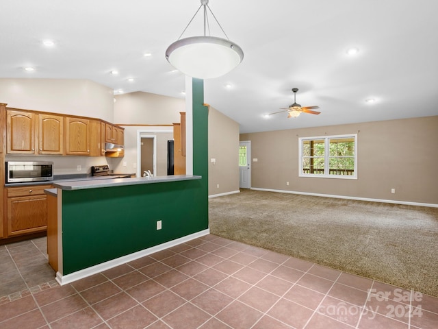 kitchen with vaulted ceiling, light carpet, hanging light fixtures, stainless steel appliances, and ceiling fan