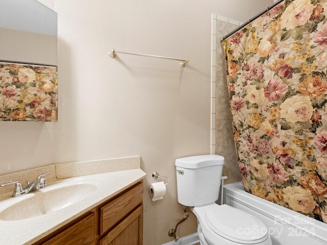 full bathroom featuring vanity, toilet, and shower / tub combo with curtain