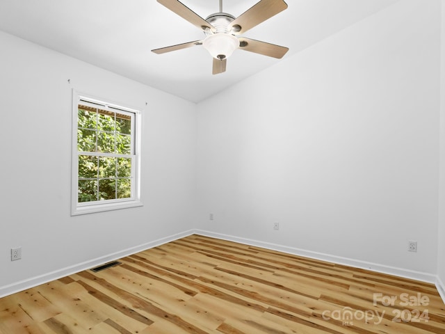 spare room featuring ceiling fan and light hardwood / wood-style flooring