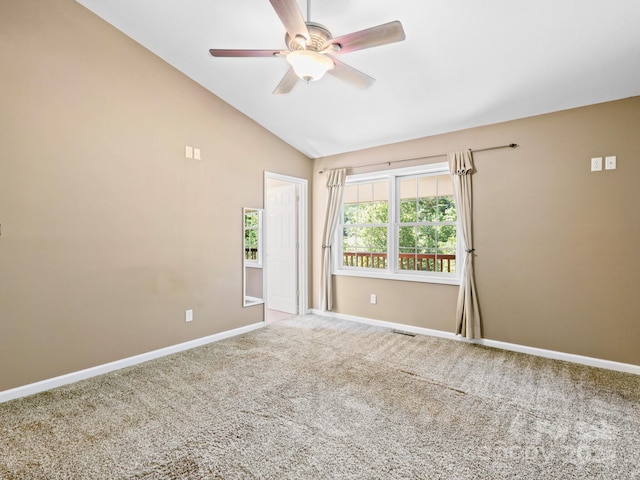 unfurnished room featuring vaulted ceiling, carpet floors, and ceiling fan