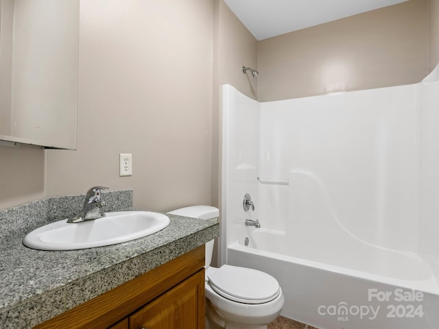 full bathroom featuring toilet,  shower combination, and vanity