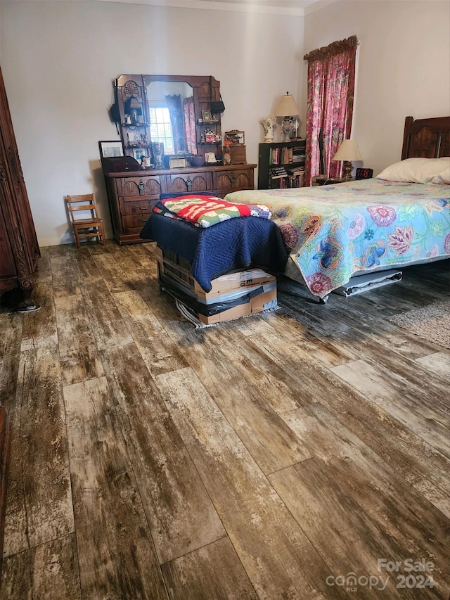 bedroom featuring dark hardwood / wood-style flooring