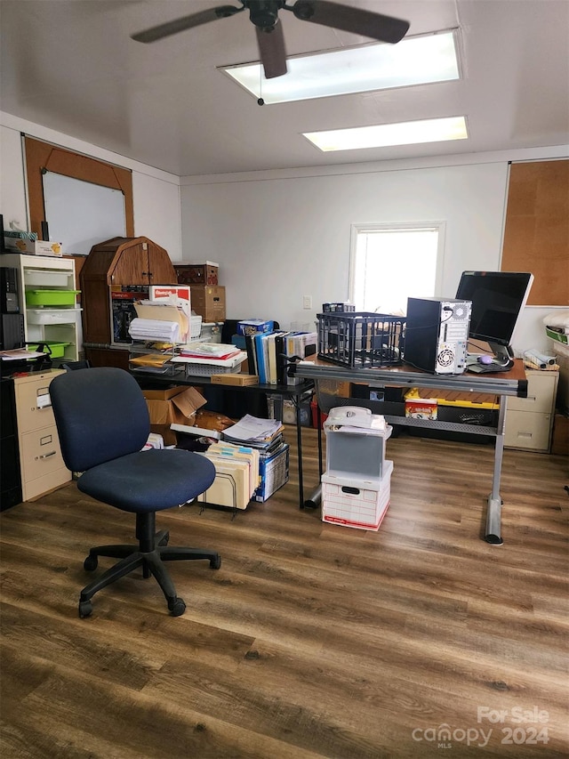 home office with dark hardwood / wood-style flooring