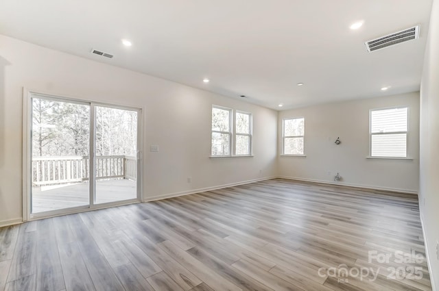 spare room featuring light hardwood / wood-style flooring