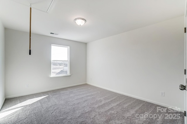 empty room featuring carpet flooring