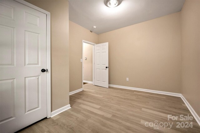 unfurnished bedroom with light hardwood / wood-style floors