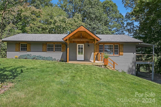 ranch-style home with a front yard