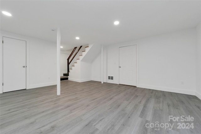 basement featuring light wood-type flooring