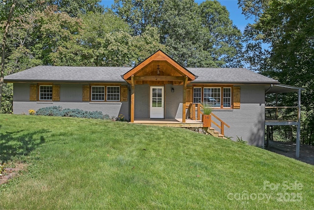 ranch-style house featuring a carport, brick siding, roof with shingles, and a front lawn