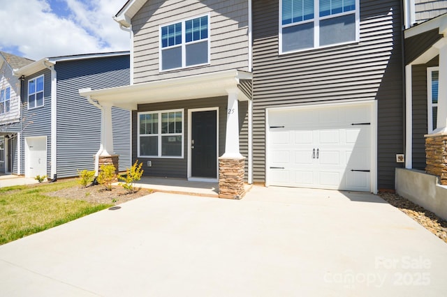 view of front of house featuring an attached garage and driveway