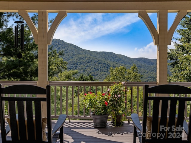 wooden terrace with a mountain view