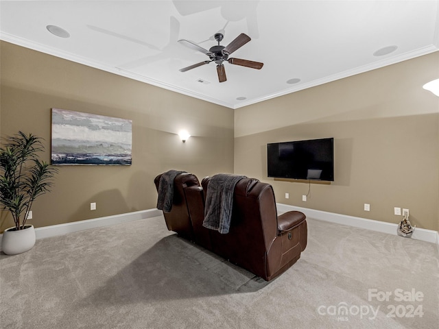 carpeted living room featuring crown molding and ceiling fan