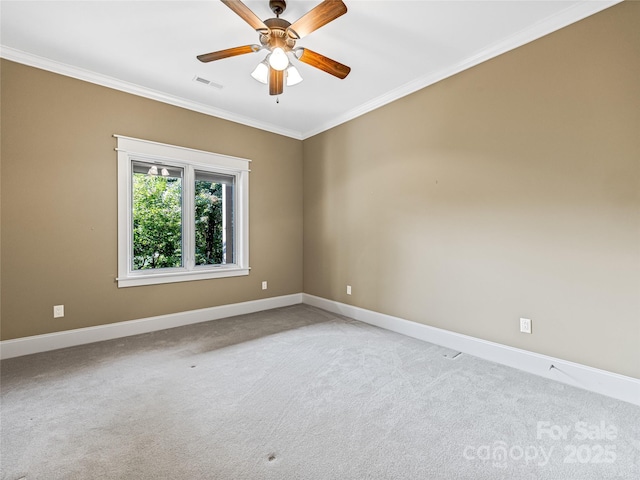 unfurnished room with light carpet, ornamental molding, visible vents, and baseboards