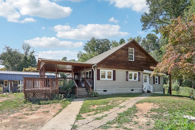 rear view of property with a yard