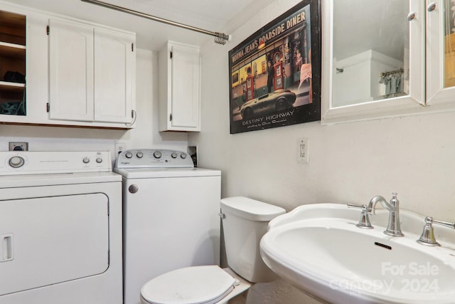 interior space featuring sink and independent washer and dryer